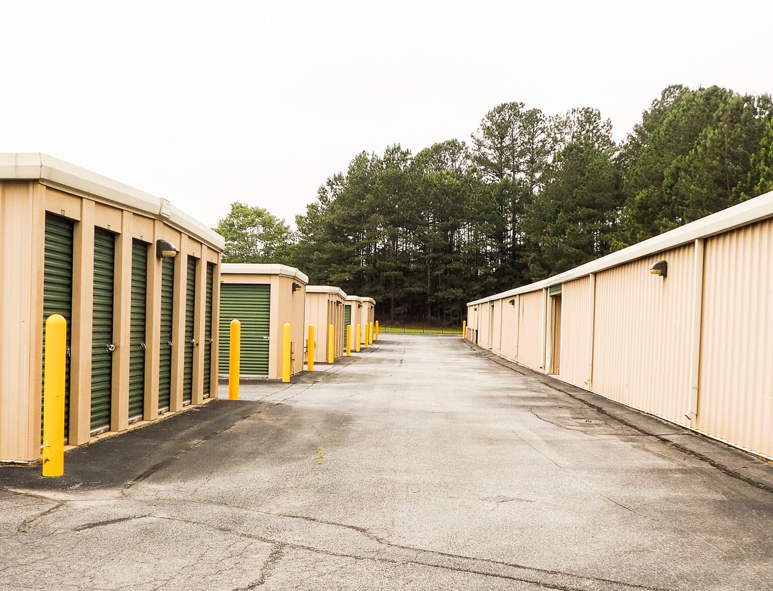 Storage buildings with yellow safety bollards